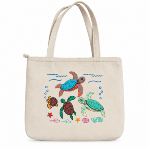 Large cream-colored embroidered sea turtle tote bag with colorful turtles, seashells, starfish, and ocean details